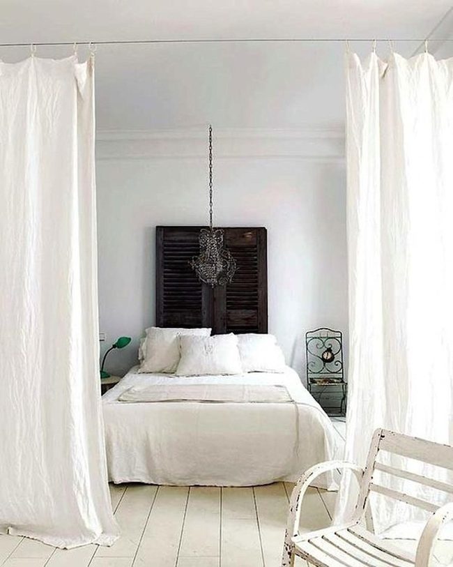 Sunlit White Bedroom With Beaded Chandelier