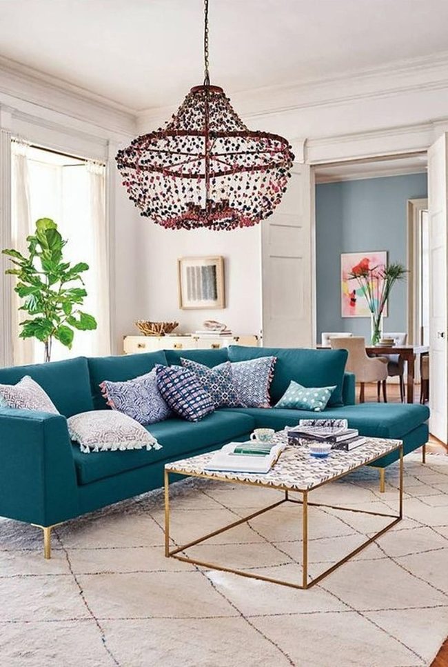 Teal Sofa With Patterned Pillows