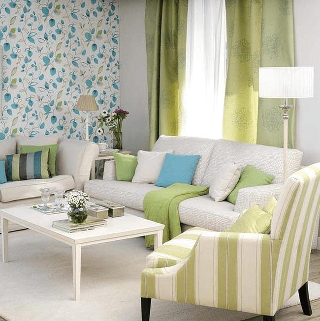 White Sofa With Blue-Green Botanical Layers