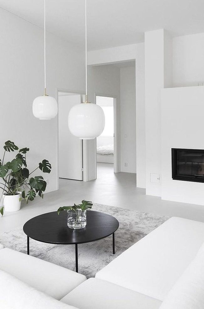 Round Black Table, White Room Simplicity