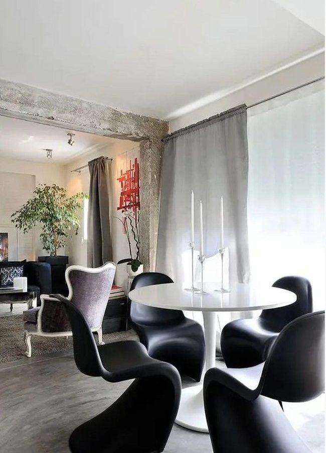Concrete Beams Meet Curved Furniture