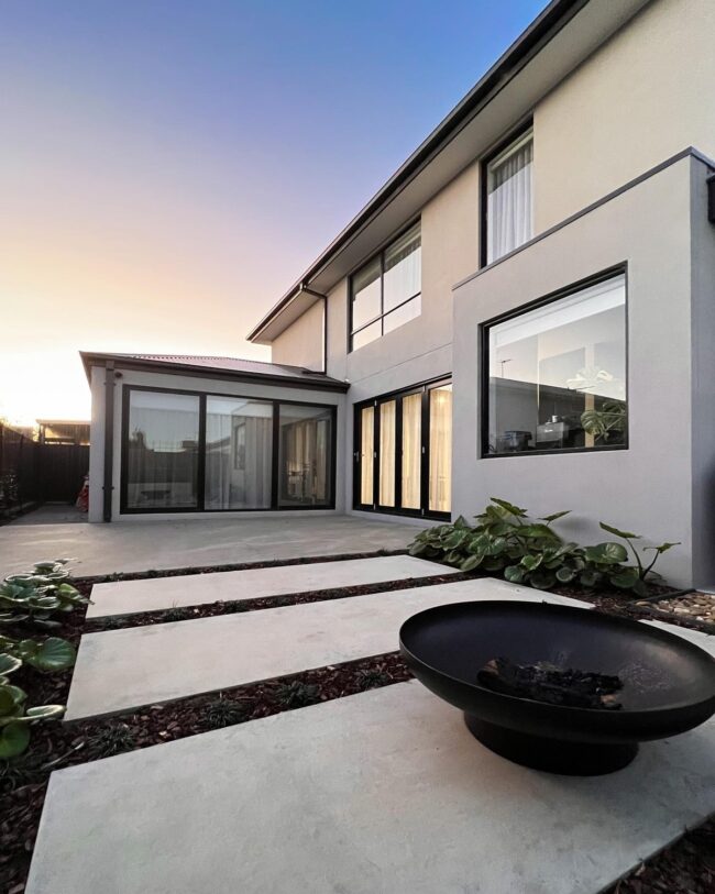 Modern Concrete Patio Featuring a Fire Pit
